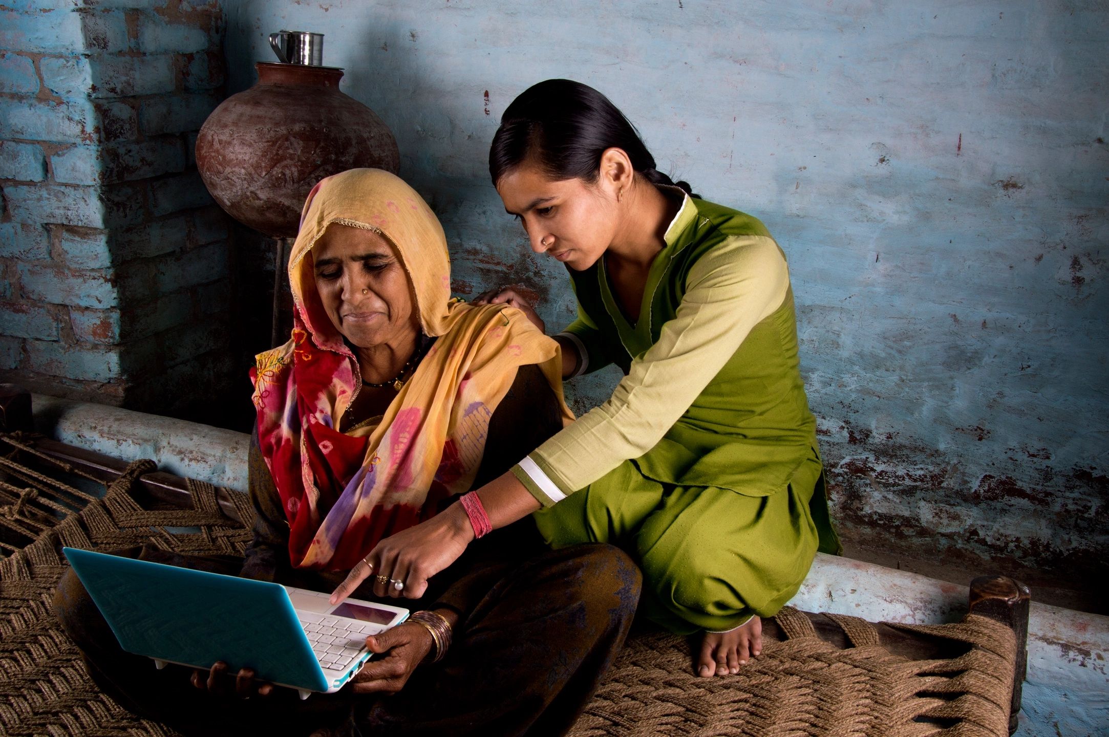 Women learning together with a laptop
